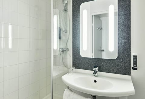 Shower, eco-friendly toiletries, hair dryer, towels