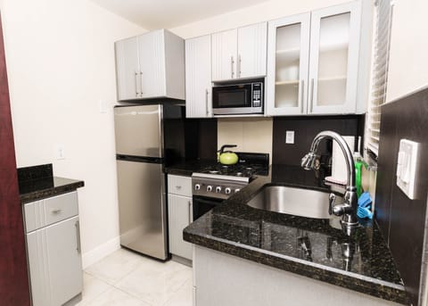 Exclusive Suite | Private kitchenette | Full-size fridge, microwave, stovetop, cookware/dishes/utensils