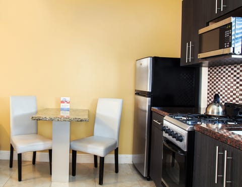 King Studio: 1 King Bed  | Private kitchen | Full-size fridge, microwave, stovetop, cookware/dishes/utensils