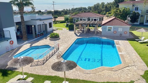 Seasonal outdoor pool, open 9:00 AM to 7:00 PM, sun loungers