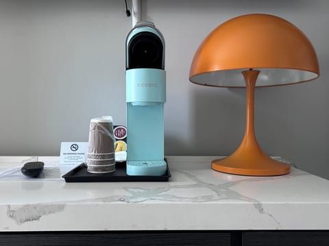 Desk, iron/ironing board, bed sheets