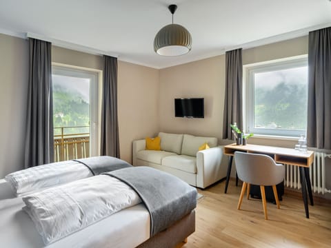 Deluxe Double Room, Balcony | Desk, laptop workspace, free WiFi, bed sheets