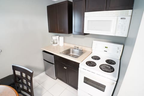 Family Two-Bedroom Suite | Private kitchen | Fridge, microwave