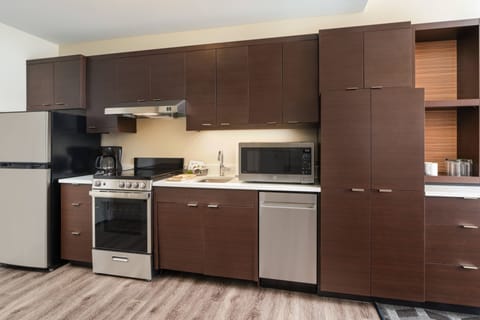 Suite, 1 Bedroom | Private kitchen | Fridge, microwave, stovetop, dishwasher