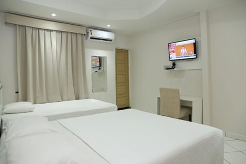 Standard Double or Twin Room | Minibar, in-room safe, laptop workspace, iron/ironing board