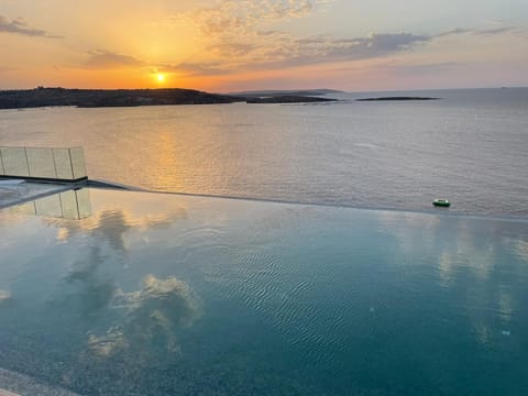 Indoor pool, seasonal outdoor pool, pool umbrellas, sun loungers