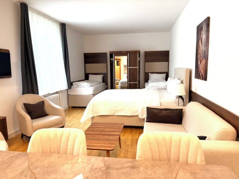 Standard Quadruple Room, Courtyard View | Iron/ironing board, free WiFi, bed sheets