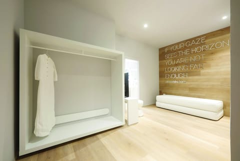 Deluxe Suite | Living area | 49-inch Smart TV with satellite channels, TV