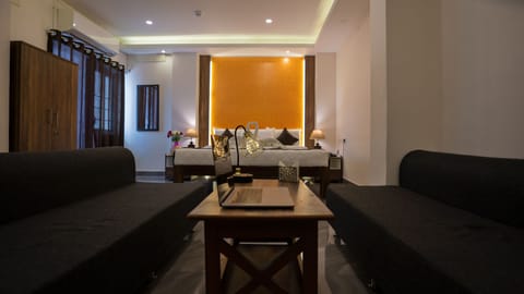 Premium Double Room | Living area | 24-inch LCD TV with digital channels, TV