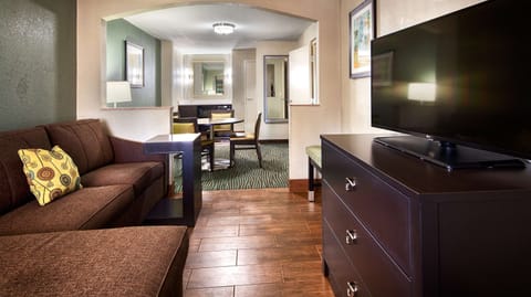 Suite, 1 King Bed, Smoking, Refrigerator & Microwave | In-room safe, desk, iron/ironing board, rollaway beds