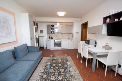 Family Apartment | Living area | 50-inch TV with cable channels