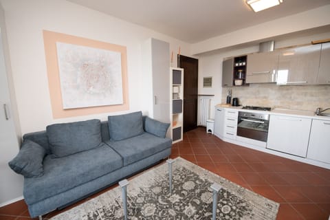 Family Apartment | Living area | 50-inch TV with cable channels