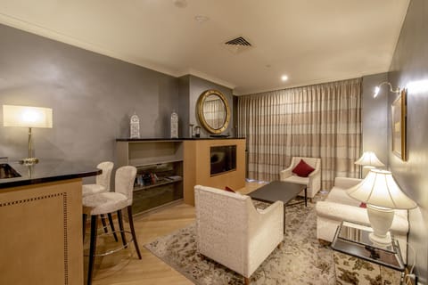 Presidential Suite | Living area | 32-inch TV with cable channels, pay movies