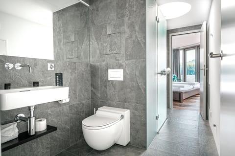 Shower, hair dryer, slippers, towels