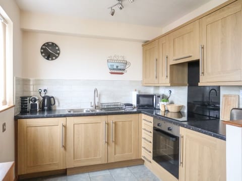 Fridge, electric kettle, toaster, cookware/dishes/utensils