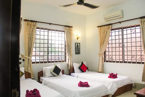 Triple Room (with FAN - Free one way airport pick up) | Individually decorated, individually furnished, blackout drapes