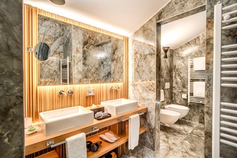 Grand Suite | Bathroom | Shower, rainfall showerhead, hair dryer, slippers