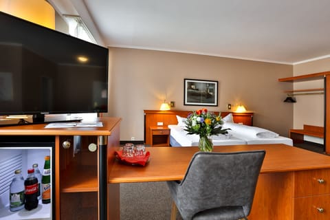 Grand Double Room, City View | Living area | 80-inch flat-screen TV with cable channels, TV