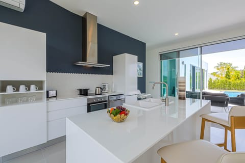 Villa | Private kitchen | Full-size fridge, microwave, oven, stovetop