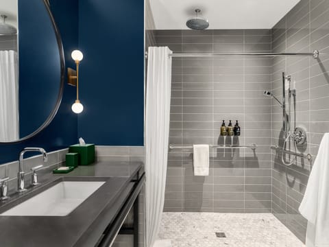 Shower, designer toiletries, hair dryer, towels