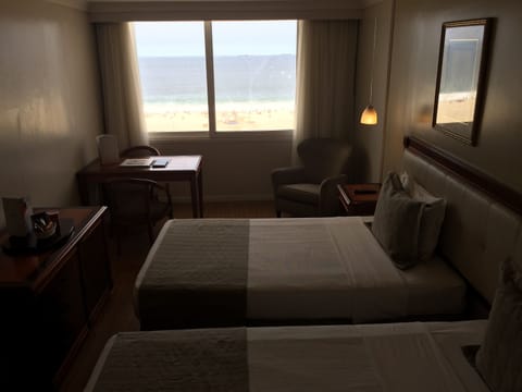 Deluxe Room, Sea View | Minibar, in-room safe, desk, laptop workspace