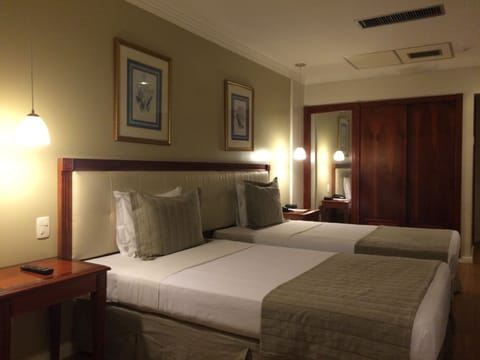 Deluxe Room, Sea View | Minibar, in-room safe, desk, laptop workspace