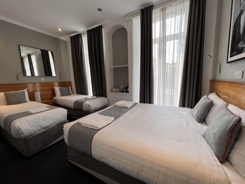 Deluxe Quadruple Room | Free WiFi, bed sheets