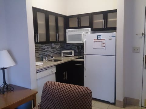 Full-size fridge, microwave, coffee/tea maker, cookware/dishes/utensils