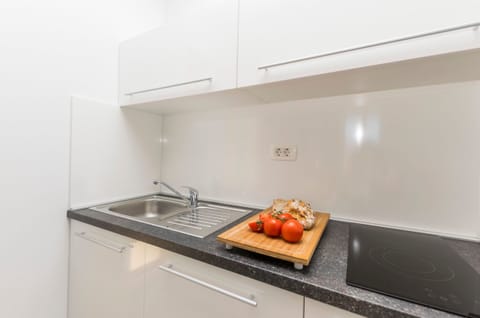 Apartment (A7) | Private kitchen | Fridge, electric kettle, toaster, dining tables