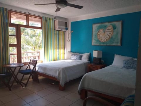 Family Double Room, 2 Double Beds, Beach View | In-room safe, individually decorated, individually furnished, desk