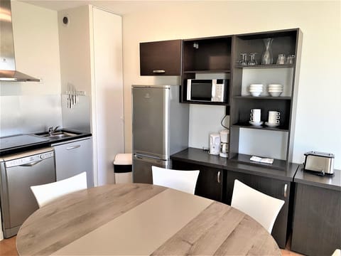 Family Apartment (6 people), 2 Bedrooms, City View | Private kitchen | Fridge, microwave, stovetop, coffee/tea maker