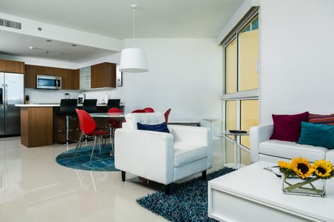 Family Condo, 2 Bedrooms, Ocean View, Corner | Living area | 32-inch flat-screen TV with cable channels, TV, iPod dock