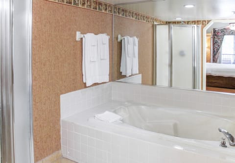 Condo, 2 Bedrooms, Kitchen | Bathroom | Combined shower/tub, deep soaking tub, free toiletries, hair dryer