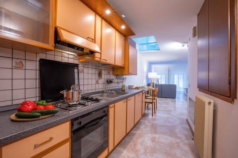 Family Apartment, 2 Bedrooms (Cozy Apartment In The Heart Of Riva) | Private kitchen | Fridge, microwave, oven, stovetop
