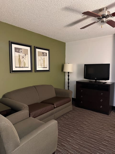 Suite, 1 Bedroom | Living area | 32-inch LCD TV with cable channels, TV, first-run movies