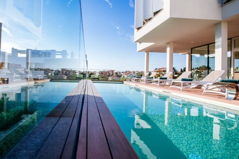 Outdoor pool, pool umbrellas, sun loungers