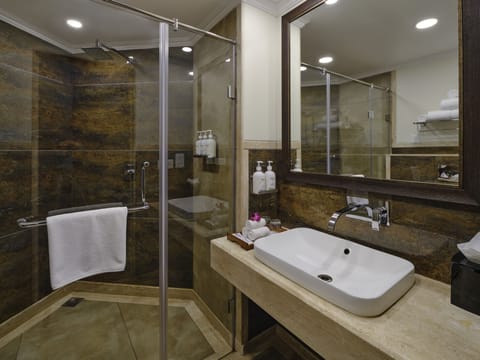 Suite, 1 King Bed | Bathroom | Shower, free toiletries, hair dryer, bathrobes