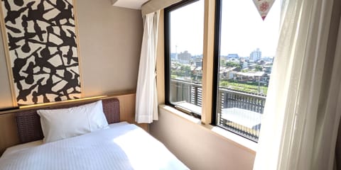 City View Twin Room, Non Smoking | Down comforters, in-room safe, blackout drapes, free WiFi