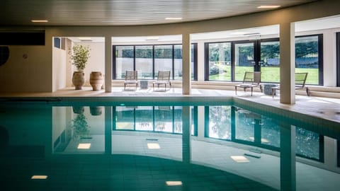 Indoor pool, open 6:00 AM to 11:00 PM, sun loungers