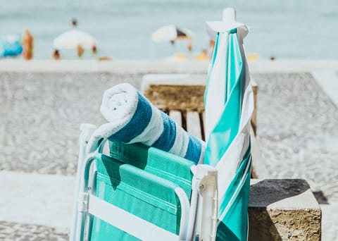 Beach nearby, beach umbrellas, beach towels, beach volleyball