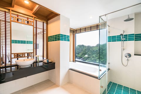 Ocean Front Suite (Unspecified View) | Bathroom | Separate tub and shower, rainfall showerhead, eco-friendly toiletries