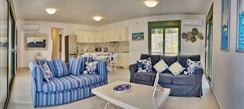 Family Villa | Living area | 40-inch Smart TV with satellite channels, TV