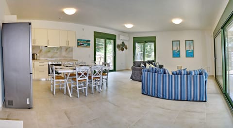 Family Villa | Living area | 40-inch Smart TV with satellite channels, TV