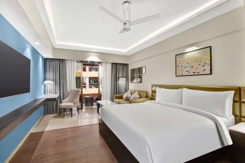 Premium Room, Balcony, Pool View | Minibar, in-room safe, desk, laptop workspace