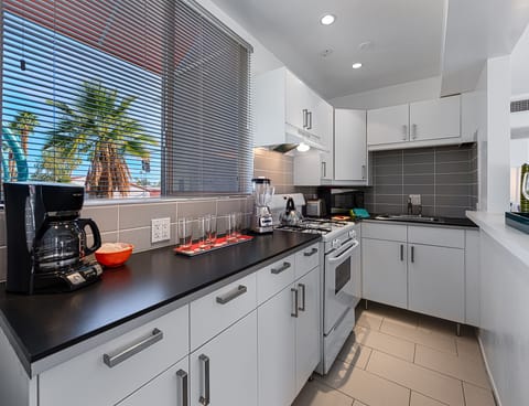Deluxe Room, 1 King Bed | Private kitchen | Full-size fridge, oven, stovetop, espresso maker