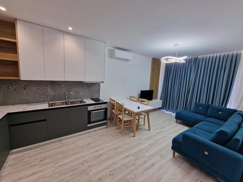 Apartment, Sea View | Living area | 32-inch flat-screen TV with cable channels, TV