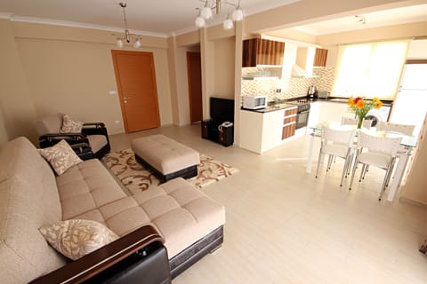 Apartment, 3 Bedrooms | Living area | 33-inch LCD TV with satellite channels, TV