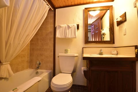 Standard Room, 1 Queen Bed | Bathroom | Combined shower/tub, hair dryer, towels