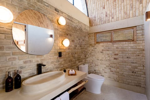 Seafront Senior Suite | Bathroom | Shower, rainfall showerhead, hair dryer, bathrobes