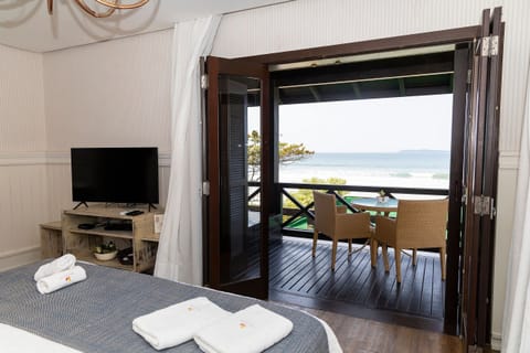 Luxury Suite, 1 King Bed, Jetted Tub, Sea View | Minibar, in-room safe, individually decorated, individually furnished